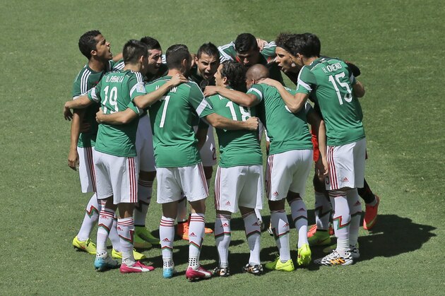 The Mexican team huddle together prior to the World Cup round of 16 soccer match between the Netherlands and Mexico at the Arena Castelao in Fortaleza, Brazil, Sunday, June 29, 2014. (AP Photo/Themba Hadebe)