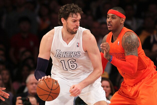 LOS ANGELES, CA - DECEMBER 25:  Pau Gasol #16 of the Los Angeles Lakers posts up Carmelo Anthony #7 of the New York Knicks during the NBA game at Staples Center on December 25, 2012 in Los Angeles, California. The Lakers defeated the Knicks 100-94.  NOTE TO USER: User expressly acknowledges and agrees that, by downloading and or using this photograph, User is consenting to the terms and conditions of the Getty Images License Agreement.  (Photo by Victor Decolongon/Getty Images)