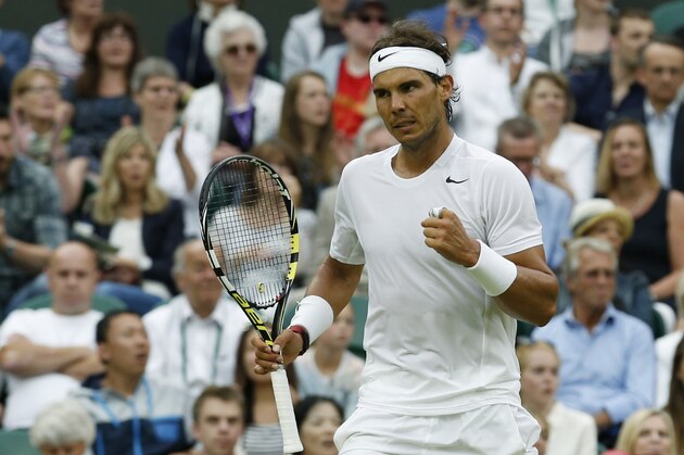Rafael Nadal of Spain reacts after winning a point against Mikhail Kukushkin of Kazakhstan during their men's singles match on Centre Court at the All England Lawn Tennis Championships in Wimbledon, London, Saturday, June 28, 2014. (AP Photo/Ben Curtis)