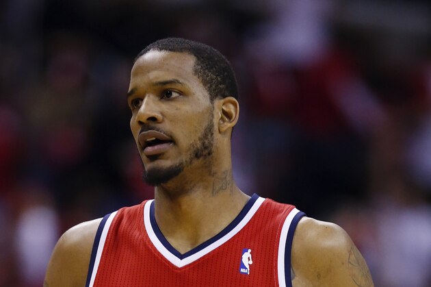 Washington Wizards forward Trevor Ariza (1) runs down the court during the first half of Game 4 of an opening-round NBA basketball playoff series against the Chicago Bulls in Washington, Sunday, April 27, 2014. (AP Photo/Alex Brandon)