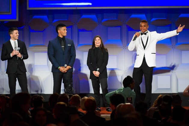 Blake Skjellerup, left, Darren Young, Jessica Aguilar and Derrick Gordon appear on stage at the GLAAD Media Awards on Saturday, May 3, 2014 in New York. (Photo by Charles Sykes/Invision/AP)