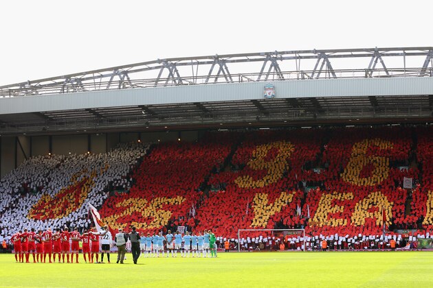 LIVERPOOL, ENGLAND - APRIL 13:  The Liverpool and Manchester City players acknowledge a minutes silence for the Hillsborough victims on the 25th anniversary of the tragedy prior to the Barclays Premier League match between Liverpool and Manchester City at Anfield on April 13, 2014 in Liverpool, England.  (Photo by Alex Livesey/Getty Images)
