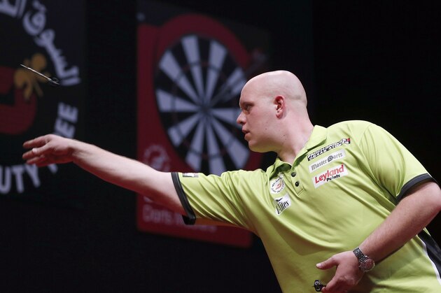 DUBAI, UNITED ARAB EMIRATES - MAY 30:  Michael Van Gerwen of the Netherlands plays against Peter Wright of England during the 2014 Dubai Duty Free Darts Masters Final match at Dubai Duty Free Tennis Stadium, Irish Village on May 30, 2014 in Dubai, United Arab Emirates.  (Photo by Francois Nel/Getty Images)