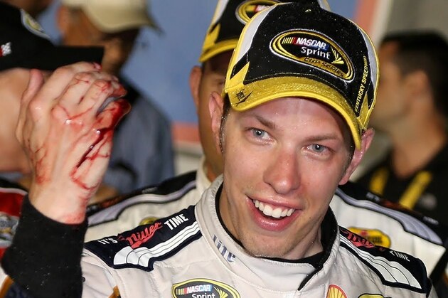 SPARTA, KY - JUNE 28:  Brad Keselowski, driver of the #2 Miller Lite Ford, celebrates in Victory Lane after winning the NASCAR Sprint Cup Series Quaker State 400 presented by Advance Auto Parts at Kentucky Speedway on June 28, 2014 in Sparta, Kentucky.  (Photo by Sean Gardner/Getty Images)