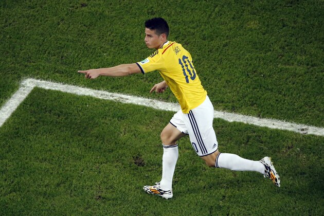 Colombia's James Rodriguez celebrates scoring his side's second goal during the World Cup round of 16 soccer match between Colombia and Uruguay at the Maracana Stadium in Rio de Janeiro, Brazil, Saturday, June 28, 2014. (AP Photo/Fabrizio Bensch, Pool)