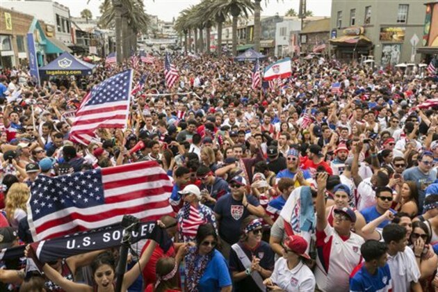 U.S.  soccer fans react as they watch the telecast of the 2014 Brazil World Cup match between the United States and Germany in Hermosa Beach, Calif., Thursday, June 26, 2014. Germany won 1-0. (AP Photo/Damian Dovarganes)