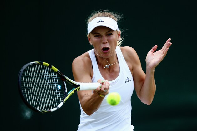 LONDON, ENGLAND - JUNE 30:  Caroline Wozniacki of Denmark during her Ladies' Singles fourth round match against Barbora Zahlavova Strycova of Czech Republic on day seven of the Wimbledon Lawn Tennis Championships at the All England Lawn Tennis and Croquet Club on June 30, 2014 in London, England.  (Photo by Dan Kitwood/Getty Images)
