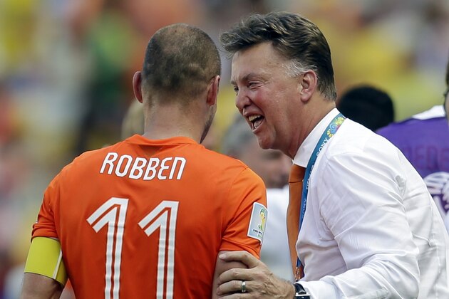 Netherlands' Arjen Robben is greeted by head coach Louis van Gaal after the World Cup round of 16 soccer match between the Netherlands and Mexico at the Arena Castelao in Fortaleza, Brazil, Sunday, June 29, 2014. The Netherlands won the match 2-1. (AP Photo/Natacha Pisarenko)