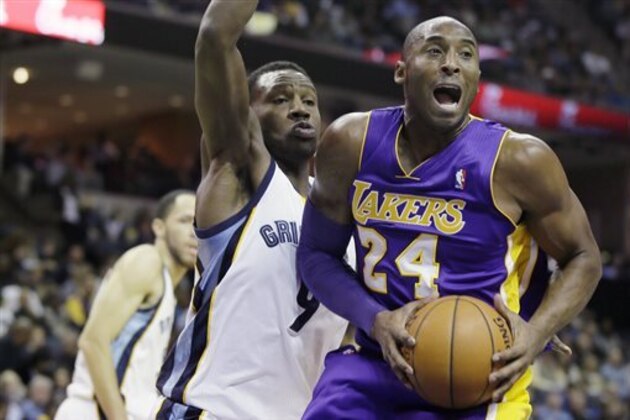 Memphis Grizzlies' Tony Allen (9) defends Los Angeles Lakers' Kobe Bryant (24) during the first half of an NBA basketball game in Memphis, Tenn., Tuesday, Dec. 17, 2013. (AP Photo/Danny Johnston)