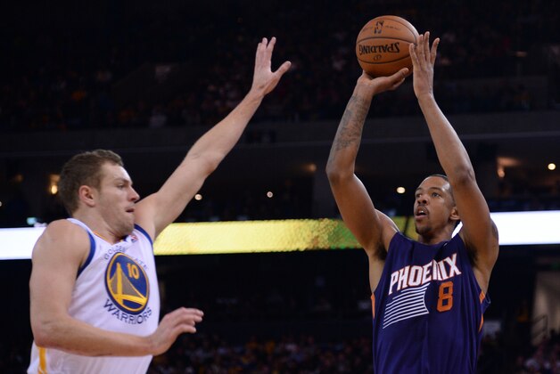 December 27, 2013; Oakland, CA, USA; Phoenix Suns power forward Channing Frye (8) shoots against Golden State Warriors power forward David Lee (10) during the second quarter at Oracle Arena. Mandatory Credit: Kyle Terada-USA TODAY Sports