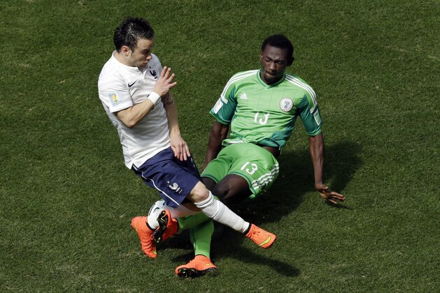 France's Mathieu Valbuena, left, and Nigeria's Juwon Oshaniwa challenge for the ball during the World Cup round of 16 soccer match between France and Nigeria at the Estadio Nacional in Brasilia, Brazil, Monday, June 30, 2014. (AP Photo/Hassan Ammar) France's Mathieu Valbuena, left, and Nigeria's Juwon Oshaniwa challenge for the ball during the World Cup round of 16 soccer match between France and Nigeria at the Estadio Nacional in Brasilia, Brazil, Monday, June 30, 2014. (AP Photo/Hassan Ammar)