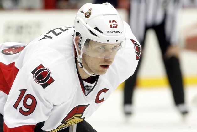 Feb 3, 2014; Pittsburgh, PA, USA; Ottawa Senators center Jason Spezza (19) at the face-off circle against the Pittsburgh Penguins during the third period at the CONSOL Energy Center. The Penguins won 2-1 in overtime. Mandatory Credit: Charles LeClaire-USA TODAY Sports