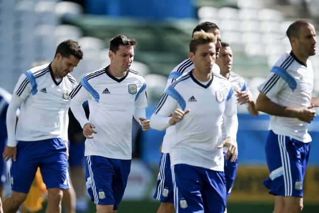 Argentina's Lionel Messi, second left, jogs with teammates during a training session at Itaquerao Stadium in Sao Paulo, Brazil, Monday, June 30, 2014. On Tuesday, Argentina will face Switzerland in their next World Cup soccer match. (AP Photo/Victor R. Caivano) Argentina's Lionel Messi, second left, jogs with teammates during a training session at Itaquerao Stadium in Sao Paulo, Brazil, Monday, June 30, 2014. On Tuesday, Argentina will face Switzerland in their next World Cup soccer match. (AP Photo/Victor R. Caivano)