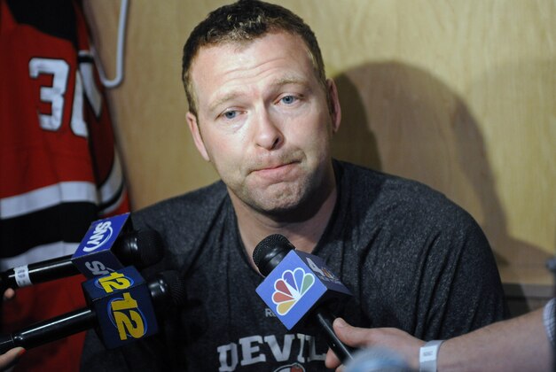 New Jersey Devils goaltender Martin Brodeur talks to the media as the NHL hockey team clean out their lockers Monday, April 14, 2014, in Newark, N.J. (AP Photo/Bill Kostroun)