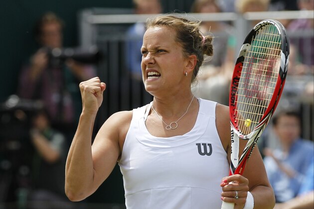 Barbora Zahlavova Strycova of the Czech Republic celebrates a point to Caroline Wozniacki of Denmark during their match at the All England Lawn Tennis Championships in Wimbledon, London, Monday, June 30, 2014. (AP Photo/Sang Tan)