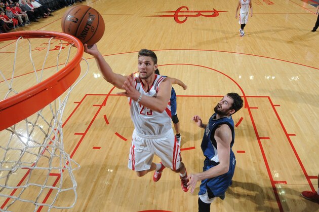 HOUSTON, TX - NOVEMBER 23:  Chandler Parsons #25 of the Houston Rockets shoots the ball against Kevin Love #42 of the Minnesota Timberwolves on November 23, 2013 at the Toyota Center in Houston, Texas. NOTE TO USER: User expressly acknowledges and agrees that, by downloading and or using this photograph, User is consenting to the terms and conditions of the Getty Images License Agreement. Mandatory Copyright Notice: Copyright 2013 NBAE (Photo by Bill Baptist/NBAE via Getty Images)