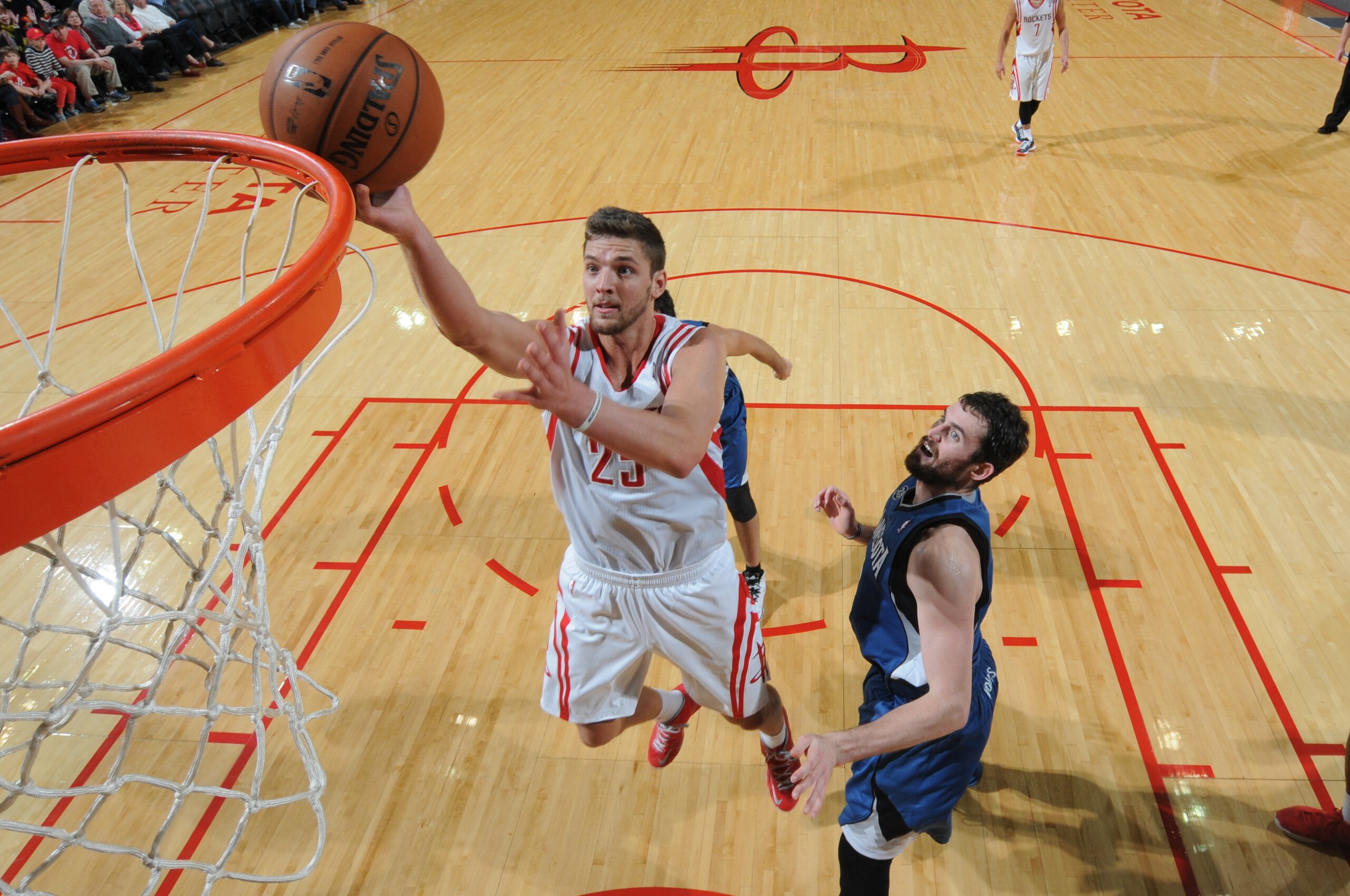 HOUSTON, TX - NOVEMBER 23:  Chandler Parsons #25 of the Houston Rockets shoots the ball against Kevin Love #42 of the Minnesota Timberwolves on November 23, 2013 at the Toyota Center in Houston, Texas. NOTE TO USER: User expressly acknowledges and agrees that, by downloading and or using this photograph, User is consenting to the terms and conditions of the Getty Images License Agreement. Mandatory Copyright Notice: Copyright 2013 NBAE (Photo by Bill Baptist/NBAE via Getty Images)