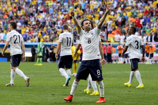 France's Mathieu Valbuena celebrates after Nigeria's Joseph Yobo scored an own goal during the World Cup round of 16 soccer match between France and Nigeria at the Estadio Nacional in Brasilia, Brazil, Monday, June 30, 2014. (AP Photo/David Vincent)