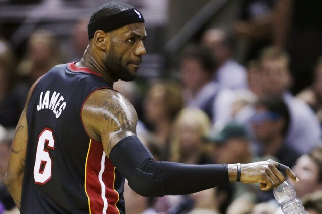 Miami Heat forward LeBron James (6) gestures to the bench during the first half in Game 5 of the NBA basketball finals against the San Antonio Spurs on Sunday, June 15, 2014, in San Antonio. (AP Photo/David J. Phillip)