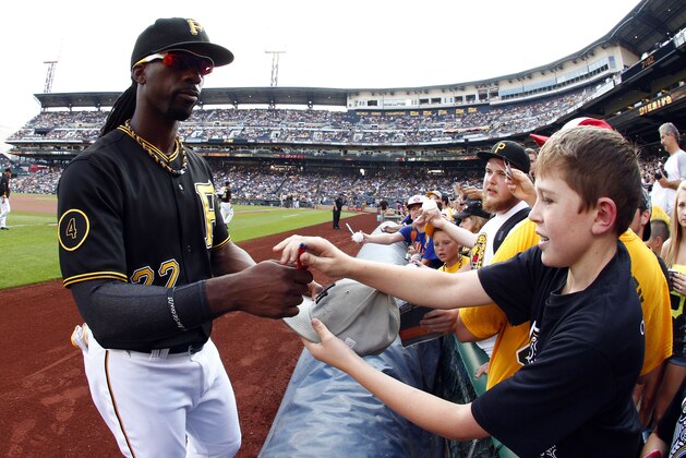 PITTSBURGH, PA - JUNE 27:  Andrew McCutchen #22 of the Pittsburgh Pirates signs autographs before the game against the New York Mets at PNC Park on June 27, 2014 in Pittsburgh, Pennsylvania.  (Photo by Justin K. Aller/Getty Images)