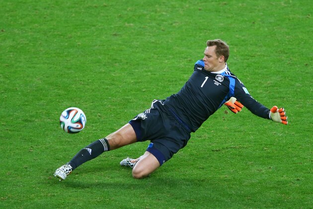 PORTO ALEGRE, BRAZIL - JUNE 30:  Goalkeeper Manuel Neuer of Germany makes a save during the 2014 FIFA World Cup Brazil Round of 16 match between Germany and Algeria at Estadio Beira-Rio on June 30, 2014 in Porto Alegre, Brazil.  (Photo by Clive Rose/Getty Images)