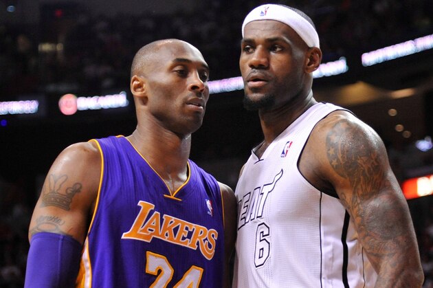 Feb 10, 2013; Miami, FL, USA; Los Angeles Lakers shooting guard Kobe Bryant (24) and Miami Heat small forward LeBron James (6) during the first half at American Airlines Arena. Mandatory Credit: Steve Mitchell-USA TODAY Sports