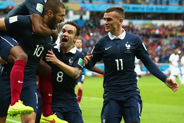 PORTO ALEGRE, BRAZIL - JUNE 15:  Karim Benzema of France celebrates scoring the first goal with Patrice Evra, Mathieu Valbuena and Antoine Griezmann during the 2014 FIFA World Cup Brazil Group E match between France and Honduras at Estadio Beira-Rio on June 15, 2014 in Porto Alegre, Brazil.  (Photo by Ian Walton/Getty Images)