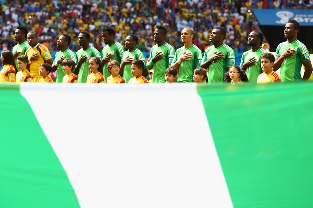 BRASILIA, BRAZIL - JUNE 30: Nigeria line up for the National Anthem prior to the 2014 FIFA World Cup Brazil Round of 16 match between France and Nigeria at Estadio Nacional on June 30, 2014 in Brasilia, Brazil.  (Photo by Quinn Rooney/Getty Images)