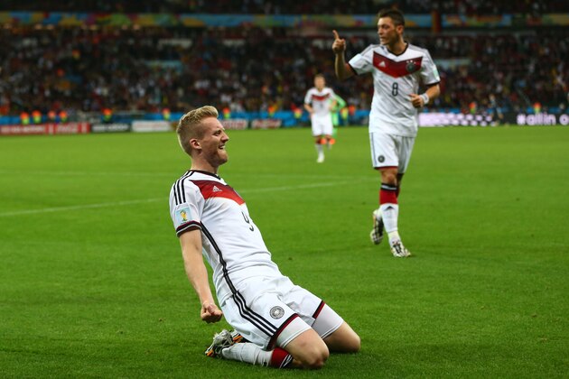 PORTO ALEGRE, BRAZIL - JUNE 30:  Andre Schuerrle of Germany celebrates scoring his team's first goal  in extra time during the 2014 FIFA World Cup Brazil Round of 16 match between Germany and Algeria at Estadio Beira-Rio on June 30, 2014 in Porto Alegre, Brazil.  (Photo by Jamie Squire/Getty Images)