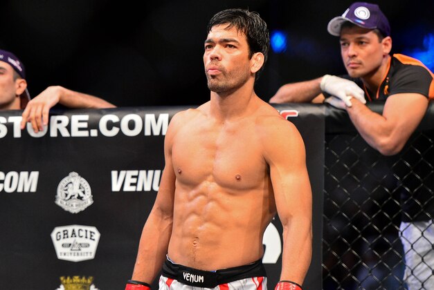 Feb 15, 2014; Jaragua do Sul, SC, Brazil; Lyoto Machida (red gloves) before his fight against Gegard Mousasi (blue gloves) during UFC Fight Night Machida vs Mousasi at Arena Jaragua. Mandatory Credit: Jason Silva-USA TODAY Sports Feb 15, 2014; Jaragua do Sul, SC, Brazil; Lyoto Machida (red gloves) before his fight against Gegard Mousasi (blue gloves) during UFC Fight Night Machida vs Mousasi at Arena Jaragua. Mandatory Credit: Jason Silva-USA TODAY Sports