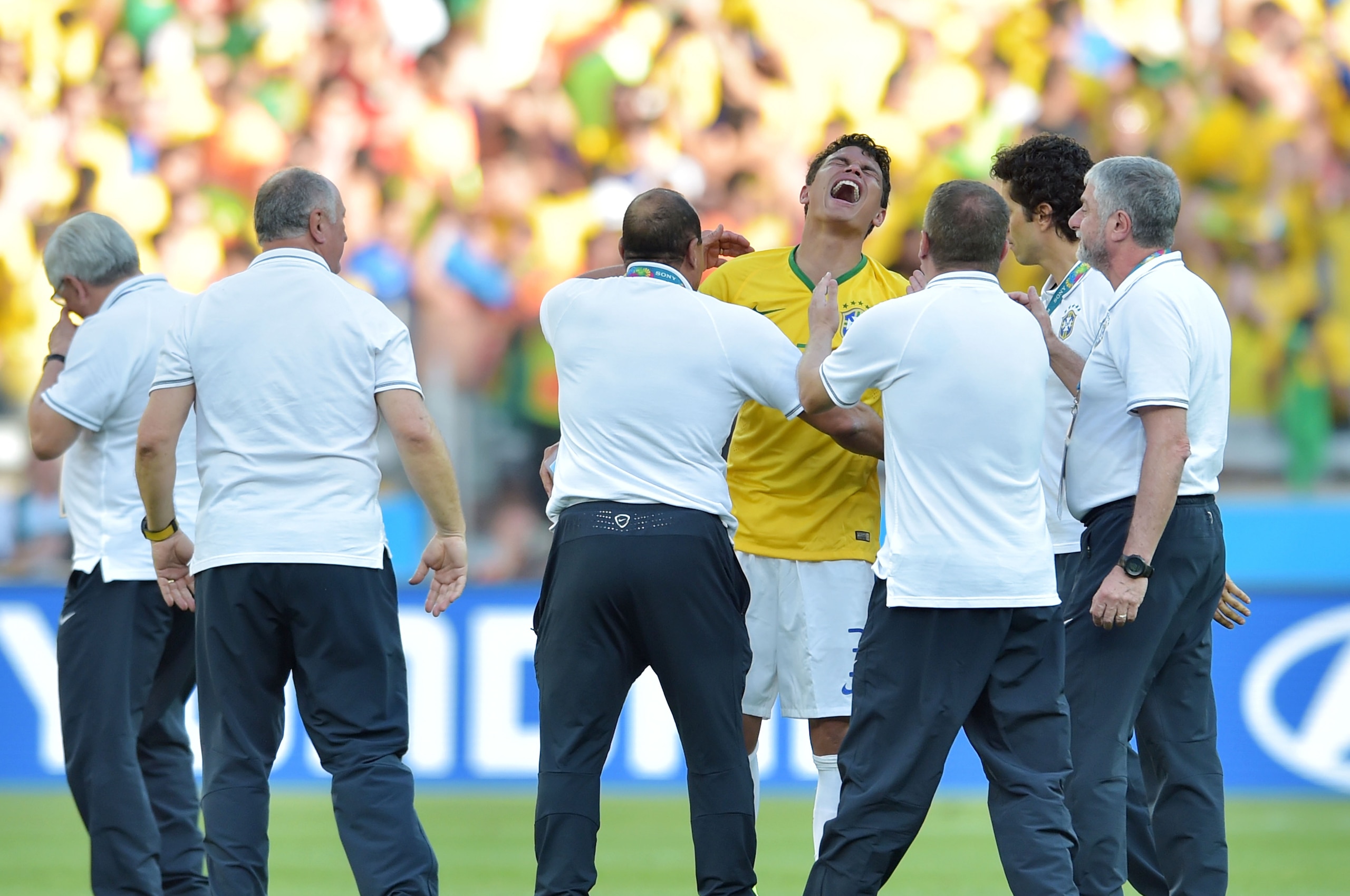 BELO HORIZONTE, BRAZIL - JUNE 28: Thiago Silva of Brazil celebrates with coaching staff after defeating Chile in a penalty shootout during the 2014 FIFA World Cup Brazil round of 16 match between Brazil and Chile at Estadio Mineirao on June 28, 2014 in Belo Horizonte, Brazil.  (Photo by Buda Mendes/Getty Images)