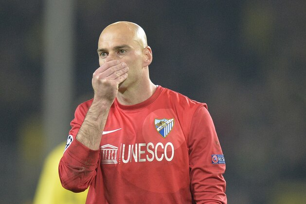 Malaga goalkeeper Willy Caballero reacts at the end of the Champions League quarterfinal second leg soccer match between Borussia Dortmund and Malaga CF in Dortmund, Germany, Tuesday, April 9, 2013. (AP Photo/Martin Meissner)
