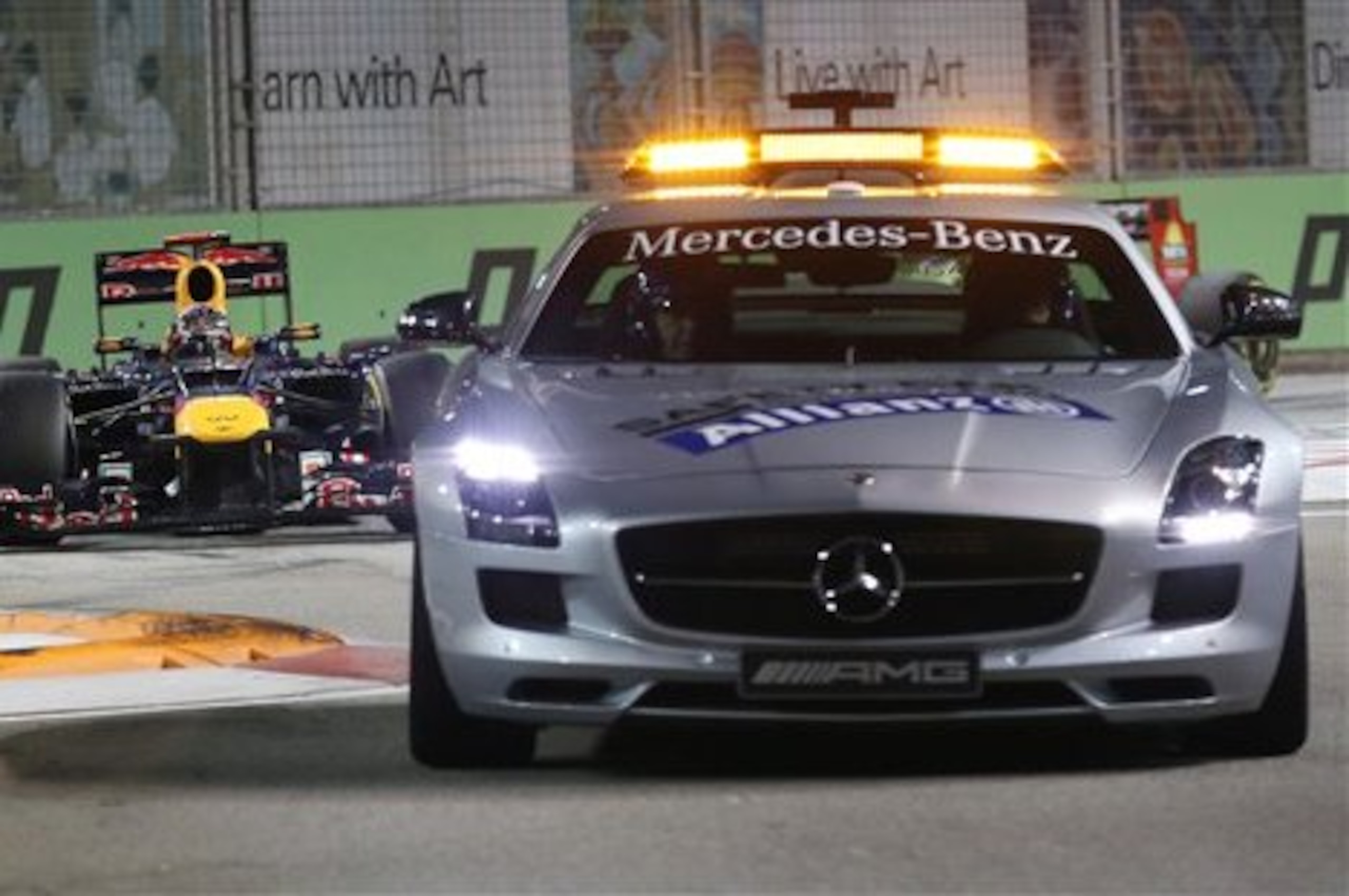 Red Bull Formula One driver Sebastian Vettel of Germany follows the safety car during the Singapore Formula One Grand Prix on the Marina Bay City Circuit in Singapore, Sunday Sept. 23, 2012. (AP Photo/Wong Maye-E) Red Bull Formula One driver Sebastian Vettel of Germany follows the safety car during the Singapore Formula One Grand Prix on the Marina Bay City Circuit in Singapore, Sunday Sept. 23, 2012. (AP Photo/Wong Maye-E)
