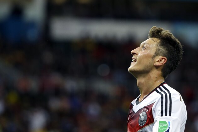 Germany's Mesut Ozil looks up during the World Cup round of 16 soccer match between Germany and Algeria at the Estadio Beira-Rio in Porto Alegre, Brazil, Monday, June 30, 2014. (AP Photo/Sergei Grits)