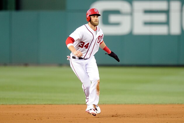 WASHINGTON, DC - JUNE 30:  Bryce Harper #34 of the Washington Nationals takes a lead off of second base in the fourth inning against the Colorado Rockies at Nationals Park on June 30, 2014 in Washington, DC.  (Photo by Greg Fiume/Getty Images)