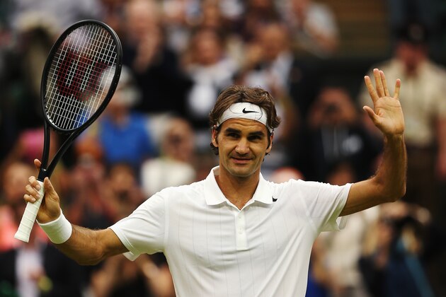 LONDON, ENGLAND - JUNE 28:  Roger Federer of Switzerland celebrates after winning his Gentlemen's Singles third round match against Santiago Giraldo of Colombia on day six of the Wimbledon Lawn Tennis Championships at the All England Lawn Tennis and Croquet Club at Wimbledon on June 28, 2014 in London, England.  (Photo by Matthew Stockman/Getty Images)