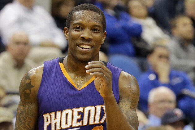 Phoenix Suns guard Eric Bledsoe (2) laughs after talking with referee Sean Corbin, left, during the third quarter of an NBA basketball game against the Minnesota Timberwolves in Minneapolis, Sunday, March 23, 2014. The Suns won 127-120. (AP Photo/Ann Heisenfelt)