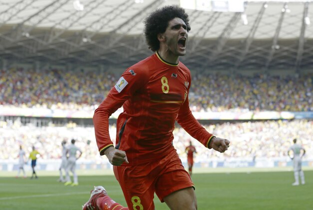 Belgium's Marouane Fellaini celebrates after scoring his side's first goal during the group H World Cup soccer match between Belgium and Algeria at the Mineirao Stadium in Belo Horizonte, Brazil, Tuesday, June 17, 2014.  (AP Photo/Hassan Ammar)
