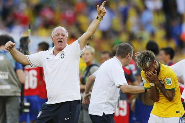 Brazil's coach Luiz Felipe Scolari, left, and Brazil's Neymar react at the end of the penalties shoot-out during the World Cup round of 16 soccer match between Brazil and Chile at the Mineirao Stadium in Belo Horizonte, Brazil, Saturday, June 28, 2014. Brazil won 3-2 on penalties. (AP Photo/Frank Augstein)