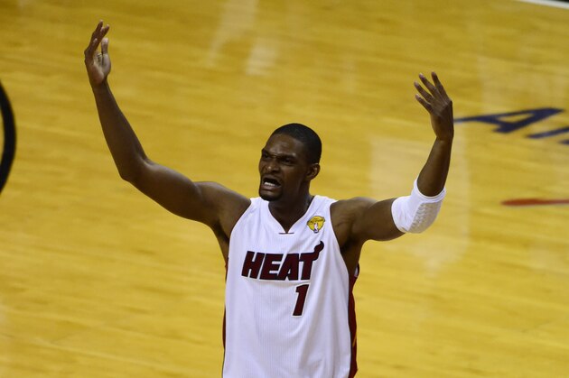 Jun 10, 2014; Miami, FL, USA; Miami Heat center Chris Bosh (1) reacts after shooting a three-pointer against the San Antonio Spurs during the second half of game three of the 2014 NBA Finals at American Airlines Arena. Mandatory Credit: Bob Donnan-USA TODAY Sports