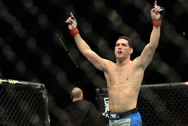 Dec 28, 2013; Las Vegas, NV, USA; Chris Weidman reacts in the cage after defeating Anderson Silva (not pictured) in their UFC middleweight championship bout at the MGM Grand Garden Arena. Mandatory Credit: Jayne Kamin-Oncea-USA TODAY Sports Dec 28, 2013; Las Vegas, NV, USA; Chris Weidman reacts in the cage after defeating Anderson Silva (not pictured) in their UFC middleweight championship bout at the MGM Grand Garden Arena. Mandatory Credit: Jayne Kamin-Oncea-USA TODAY Sports
