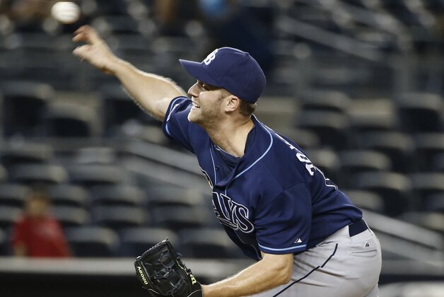 Tampa Bay Rays relief pitcher Brad Boxberger delivers in the 12th inning of the Rays 4-3 victory over the New York Yankees in a baseball game at Yankee Stadium in New York, Monday, June 30, 2014. (AP Photo/Kathy Willens)