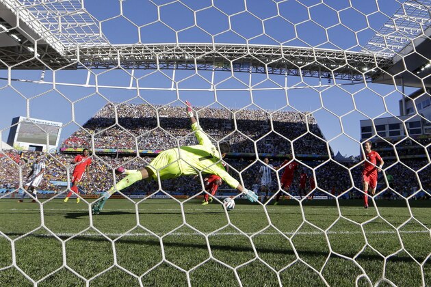 Switzerland's goalkeeper Diego Benaglio dives but can't stop a goal by Argentina's Angel di Maria in extra time during the World Cup round of 16 soccer match between Argentina and Switzerland at the Itaquerao Stadium in Sao Paulo, Brazil, Tuesday, July 1, 2014. (AP Photo/Victor R. Caivano)