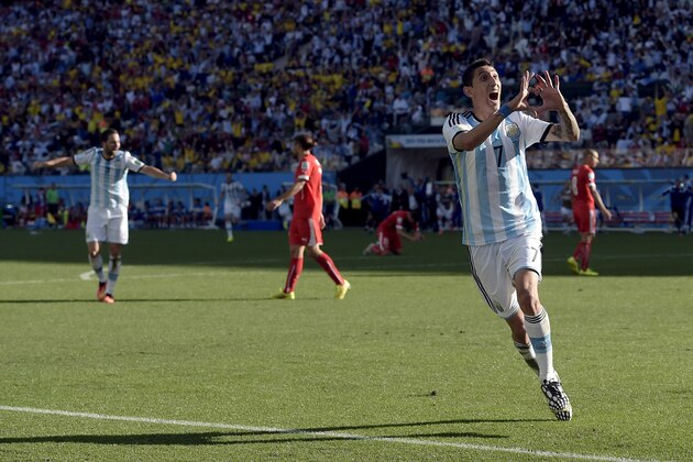 Argentina's Angel di Maria celebrates after scoring his side's only and winning goal in extra time during the World Cup round of 16 soccer match between Argentina and Switzerland at the Itaquerao Stadium in Sao Paulo, Brazil, Tuesday, July 1, 2014. Argentina defeated Switzerland 1-0 to move on to the quarterfinals. (AP Photo/Manu Fernandez)