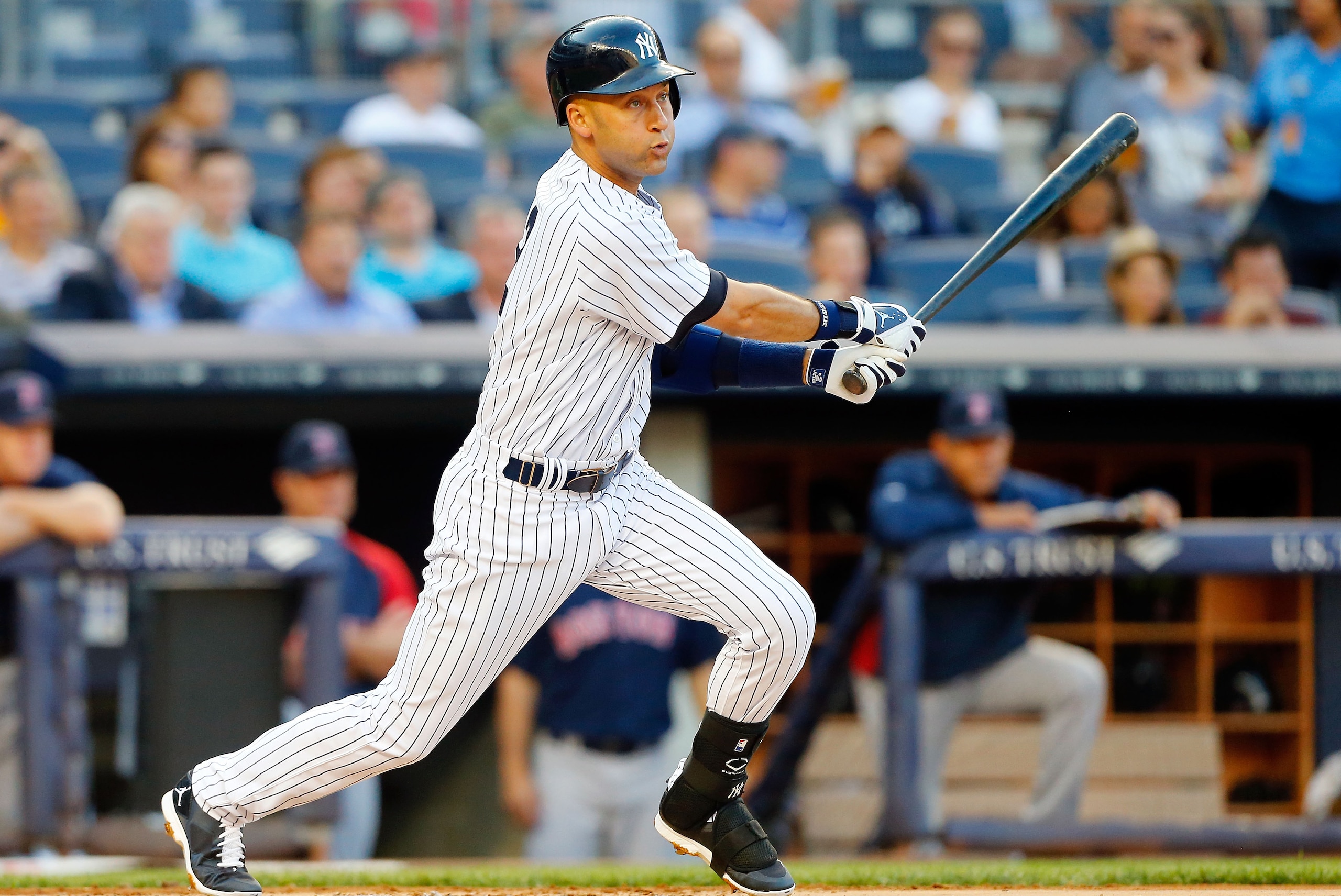 NEW YORK, NY - JUNE 27:  Derek Jeter #2 of the New York Yankees gets a first inning base hit against the Boston Red Sox at Yankee Stadium on June 27, 2014 in the Bronx borough of New York City.  (Photo by Jim McIsaac/Getty Images)