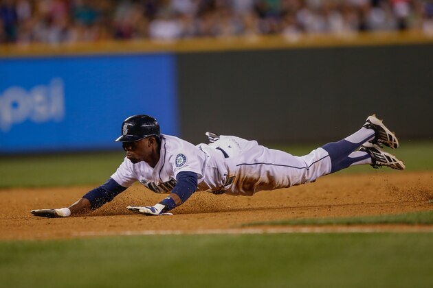 SEATTLE, WA - JUNE 24:  James Jones #99 of the Seattle Mariners steals third base in the seventh inning against the Boston Red Sox at Safeco Field on June 24, 2014 in Seattle, Washington.  (Photo by Otto Greule Jr/Getty Images)