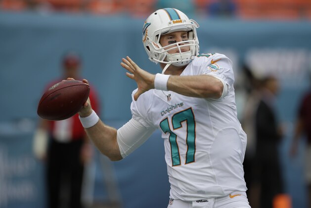 Miami Dolphins quarterback Ryan Tannehill (17) throws the football during team warm-ups before an NFL football game against the New York Jets, Sunday, Dec. 29, 2013, in Miami Gardens, Fla. (AP Photo/Lynne Sladky)