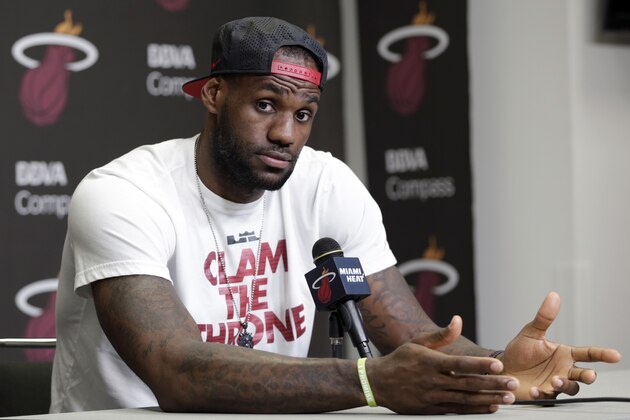 FILE - In this June 17, 2014 file photo, Miami Heat's LeBron James gestures as he answers a question during a news conference in Miami. A person familiar with the situation tells The Associated Press that James has decided to opt out of the final two years of his contract with the Heat and become a free agent on July 1. Opting out does not mean James has decided to leave the Heat, said the person, who spoke on condition of anonymity because neither the four-time NBA MVP nor the team had made any public announcement. (AP Photo/Alan Diaz, File)