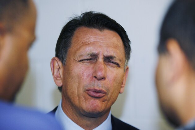 Detroit Red Wings General Manager Ken Holland winces as he talks to reporters after the Red Wings lost to the San Jose Sharks 3-2 in Game 7 of an NHL hockey Stanley Cup Western Conference semifinal playoff series Thursday, May 12, 2011, in San Jose, Calif.  (AP Photo/Paul Sakuma)