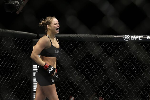Ronda Rousey reacts after defeating Sara McMann following a UFC 170 mixed martial arts women's bantamweight title fight on Saturday, Feb. 22, 2014, in Las Vegas. (AP Photo/Isaac Brekken)